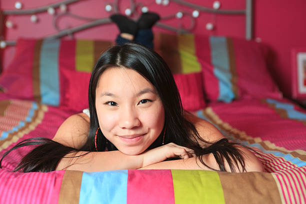 istock Teenager Home Lifestyle -  Comfortable on Bed 184984843