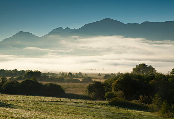 istock Morning Mist in Bavarian Alps Landscape at Dawn 184984884