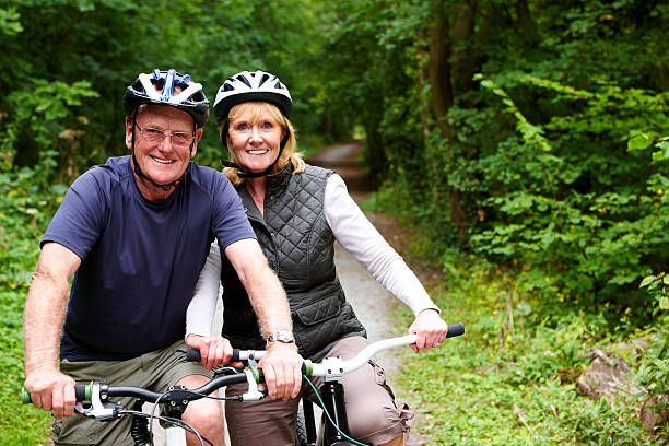 istock Mature couple with bicycle in countryside 184985204