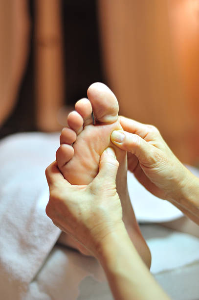 istock Foot reflexology massage close up 184985313