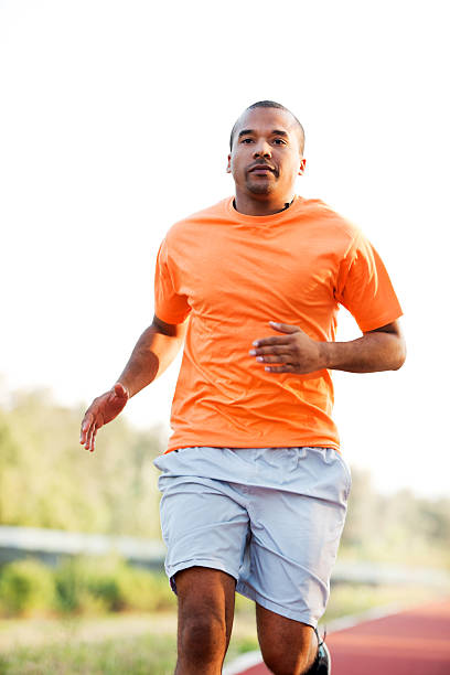 istock African-American man running at the marathon. 184985363