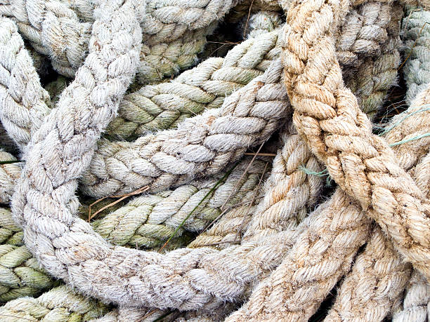 istock pile of used and old thick ship ropes 184986139