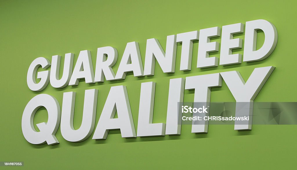 Quality Guaranteed Quality Sign on Green Background. Soft Focus. Communication Stock Photo