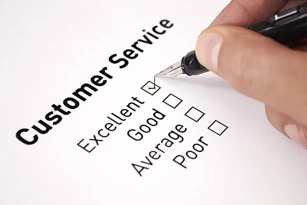 Photo of A man chooses excellent on a customer service survey