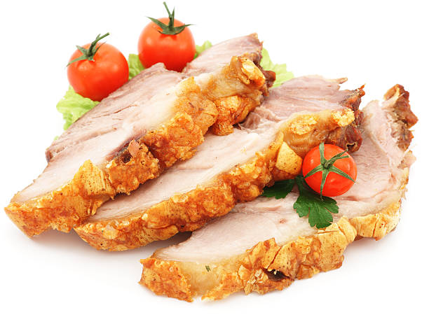istock Roasted pork with tomato, salad and parsley isolated on white 184987285