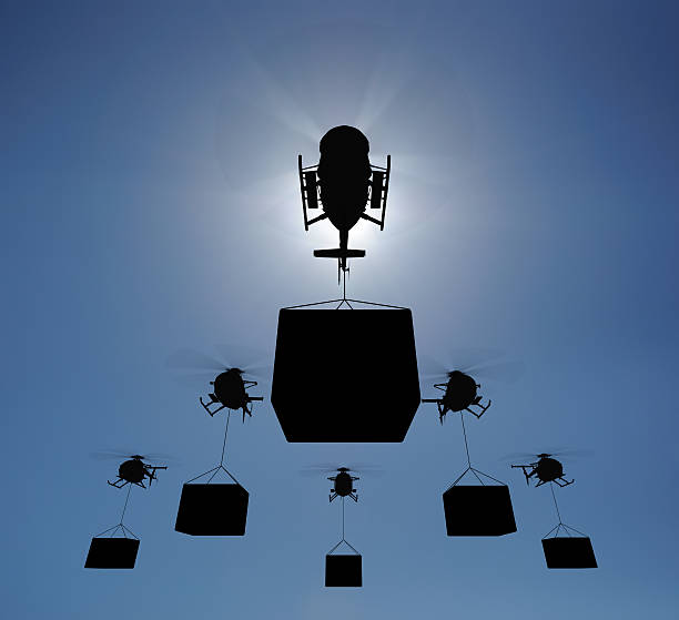 Helicopter silhouettes in the sky stock photo