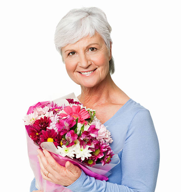 istock Senior Woman With Flowers - Isolated 184988047