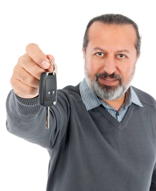 istock man gives car key 184988539