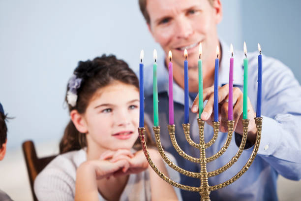 istock Father and daughter celebrating Hanukkah 184988657