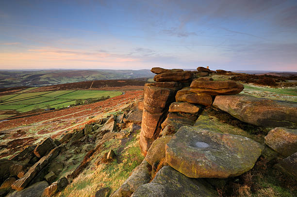 Stanage Edge Rocks, Peak District "Looking along the iconic Stanage Edge in The Peak District National Park, taken shortly after sunrise on a cold winter day. XL image size.Please see more Peak District images in my lightbox below" peak district national park photos stock pictures, royalty-free photos & images