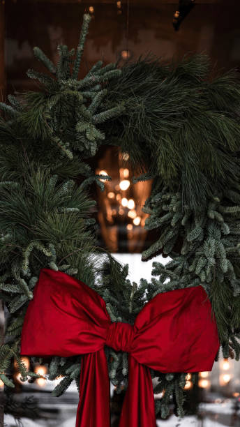 istock Festive Holiday Wreath with Tree and Bow 1849891634