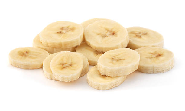 istock A pile of sliced ripe bananas on a white background 184989270