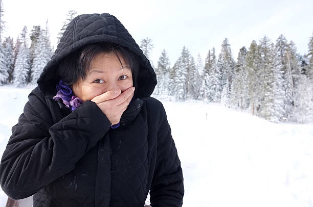 istock Asian woman feeling cold  around snow 184989320