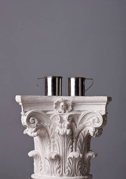 istock metal mugs on a corinthian capital 184989337