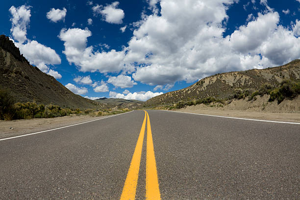istock Rural Highway Double Yellow Line Cloud Sky 184989412