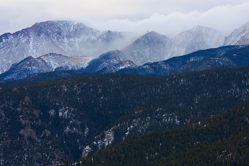 Pikes Peak Colorado engulfed in a thick layer of fog and mist.