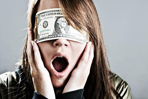 istock Young woman with dollar bill blindfold gasps in shock 184989688