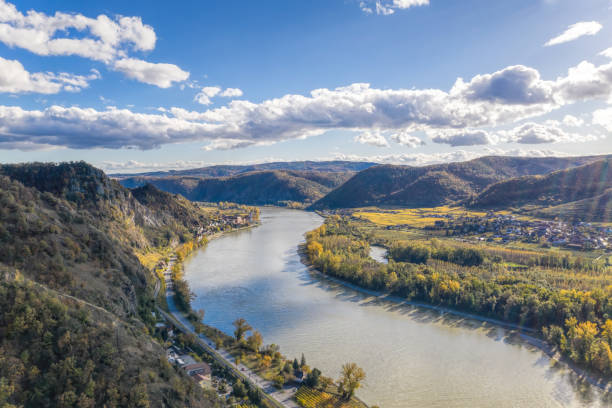 Panorama of Wachau valley (UNESCO) during autumn with Danube river near the Durnstein village in Lower Austria, Austria Panorama of Wachau valley (UNESCO) during autumn with Danube river near the Durnstein village in Lower Austria, Austria blue danube stock pictures, royalty-free photos & images