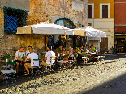 Rome, Italy - August 19, 2023: View of the famous picturesque street of Via dei Coronari.