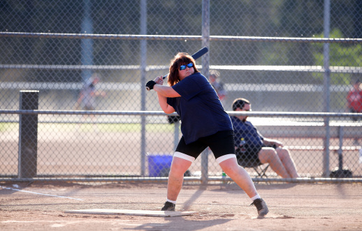 woman ready to bat at a baseball or softball game