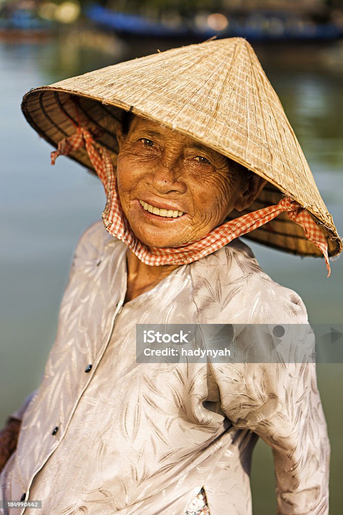 Vietnamese water taxi in Hoi An "Water taxis are the quickest and easiest way to cross The Thu Bon River in Hoi An, Vietnam." Adult Stock Photo