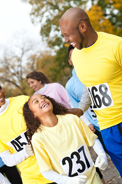 istock Man laughing with daughter during charity walk 184990900