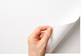 Close-up shot of opening a blank page by the hand