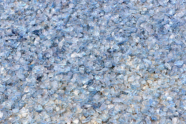 Background of broken glass on the floor in gray tones.