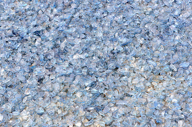 broken glass blue shards ready for recycling stock photo