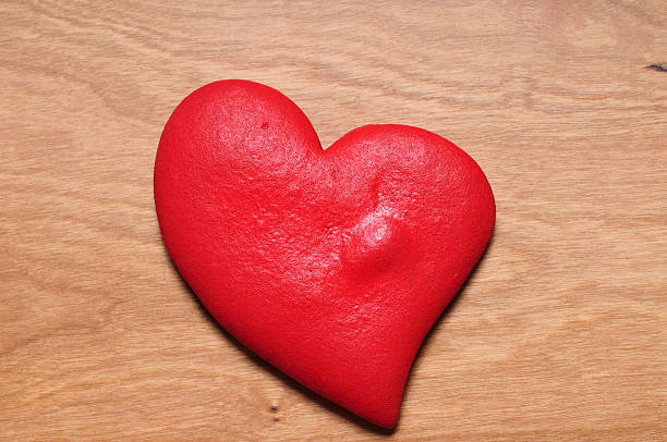 istock Heart made of dough on wooden table 184991156