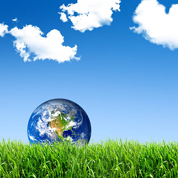 istock The earth on meadow with clouds and a blue sky 184991218
