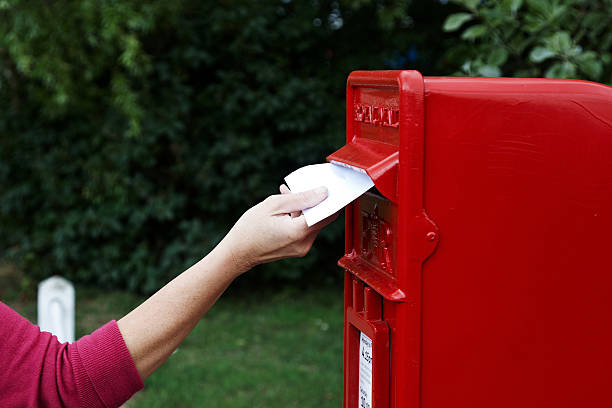 istock Mature woman posting a letter 184991928