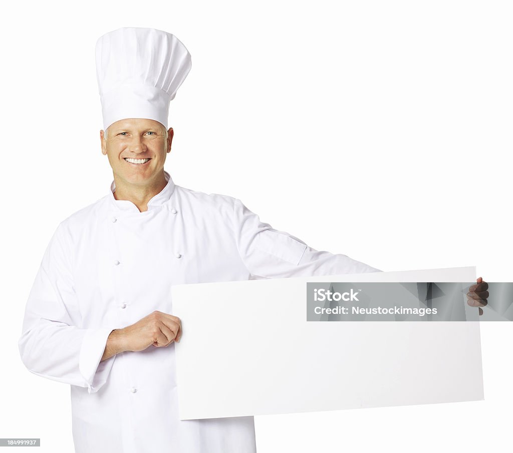 Chef sosteniendo un cartel en blanco aislado - Foto de stock de 50-59 años libre de derechos