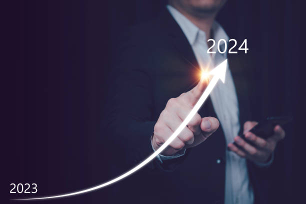 istock 2024 Business goal, Business man pointing chart graph with 2024, future marketing technology concept, Strategy work calendar from 2023 to 2024 1849920217