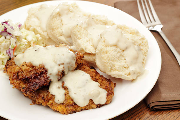 Chicken fried steak Chicken fried steak with biscuits and country gravy. Served with a side of slawPlease see some similar pictures from my portfolio: chicken fried steak stock pictures, royalty-free photos & images