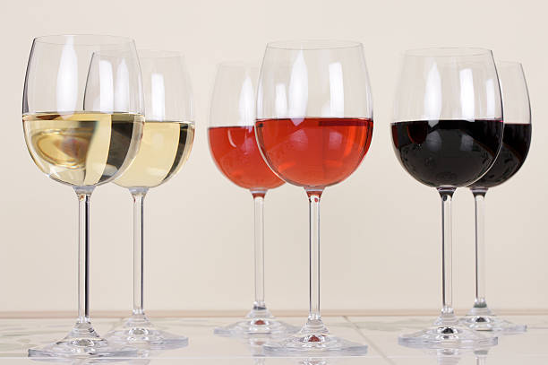 istock Two glasses each of both Red, white and Rose wine 184992292