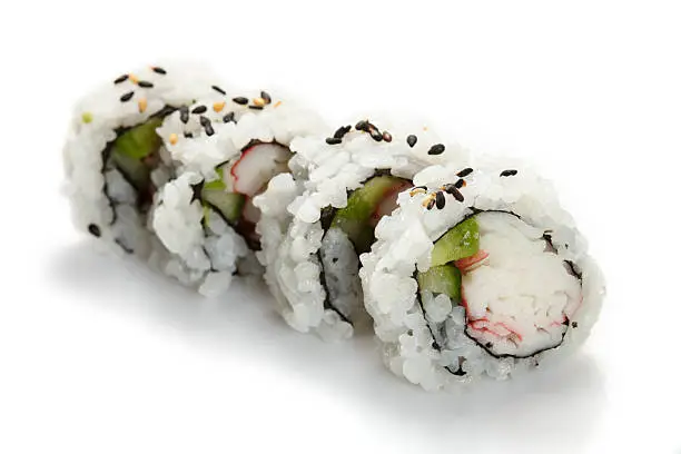 "Sushi uramaki, inside out, california roll, on a white background."