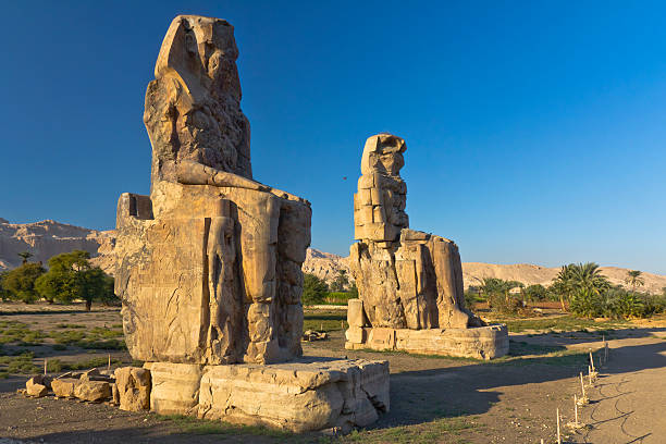 Colossi of Memnon "Giant stone statues of Pharaoh Amenhotep III near  the Valley of the Kings, Luxor, EgyptSee more EGYPT images here:" temple of hatshepsut photos stock pictures, royalty-free photos & images
