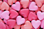 Background: Colorful, heart shaped candies suitable for Valentine greetings