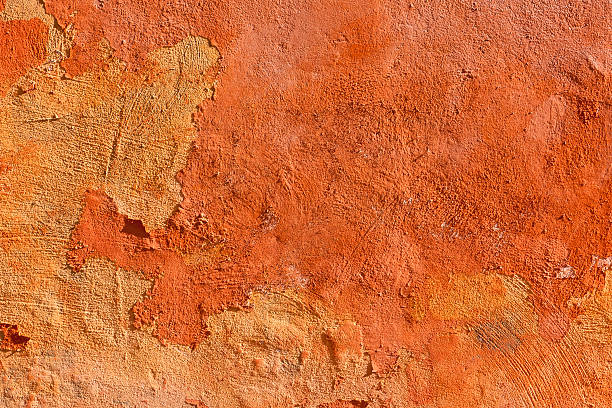 istock Ochre Red Roman Wall Texture Background with Peeling Plaster 184993573