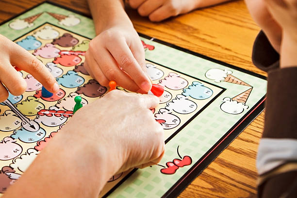 istock Family Playing A Board Game Together 184993689