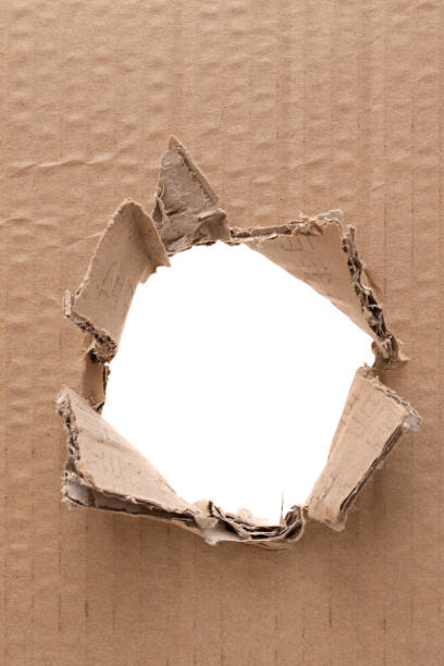 istock Ripped hole in cardboard background textured 184993736