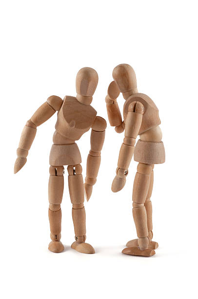 istock Rumors - wooden mannequin wispering 184993860