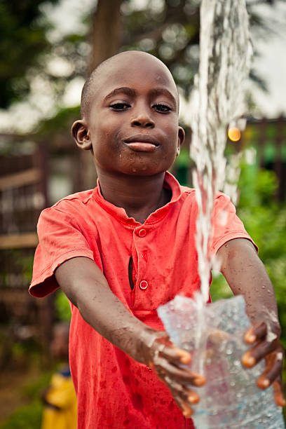 istock African Boy By Water Pump 184993870