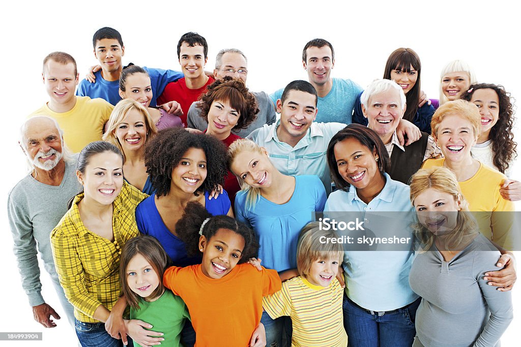 Large Group of Happy People standing together. Portrait of a large group of a Mixed Age people smiling and embracing together. Multiracial Group Stock Photo