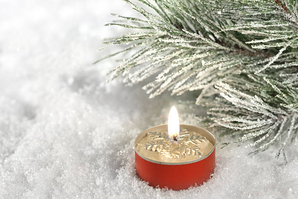 istock Candle In Snow Close-up 184993935
