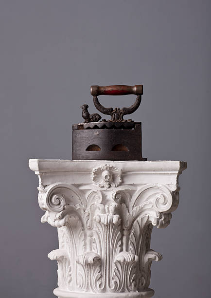 istock old ironing machine on a corinthian capital 184994109