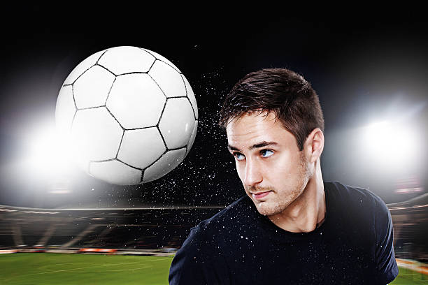 istock football player scoring goal using his head 184994132