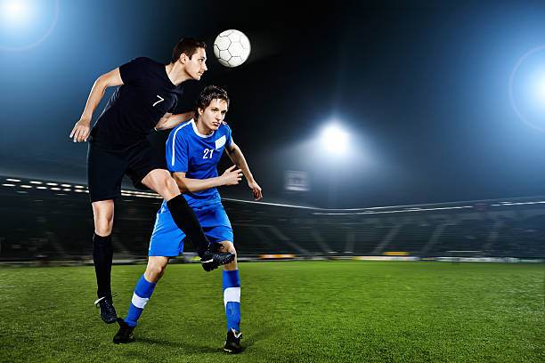 istock men playing football in stadium 184994133