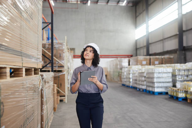istock Female engineer checking warehouse shipments with a digital tablet 1849942278